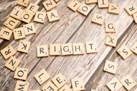 scrabble tiles spelling the word right next to each other