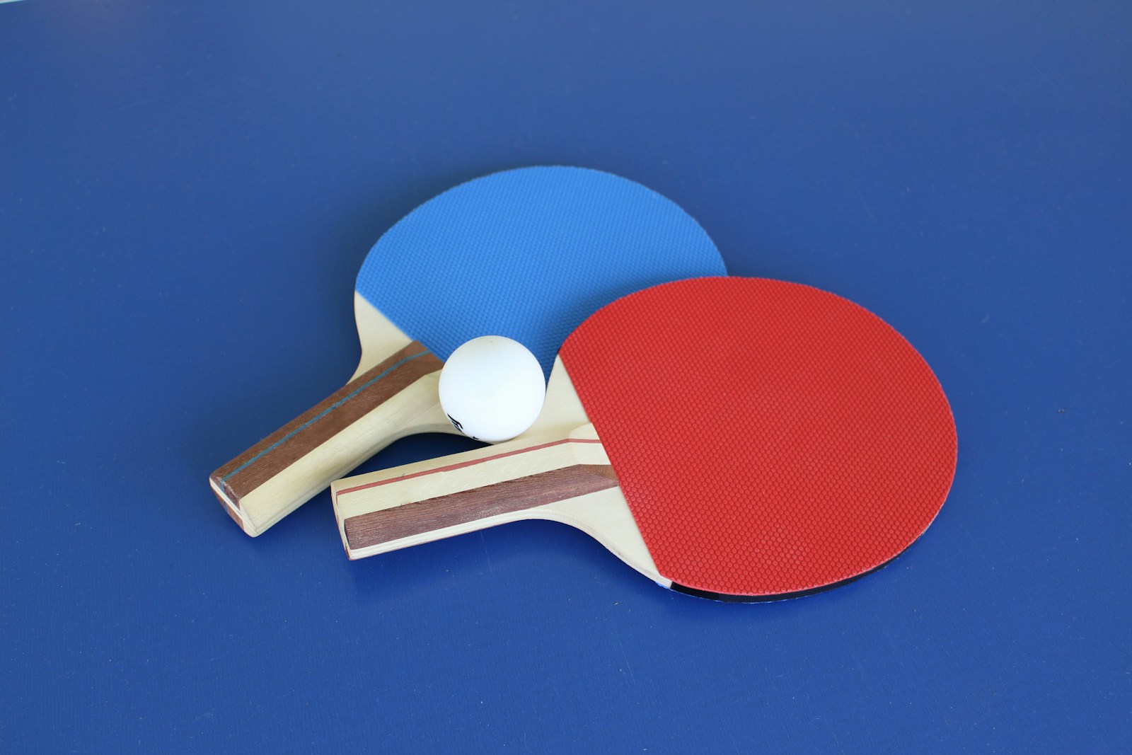blue and white ball and white golf club - Indian Sports