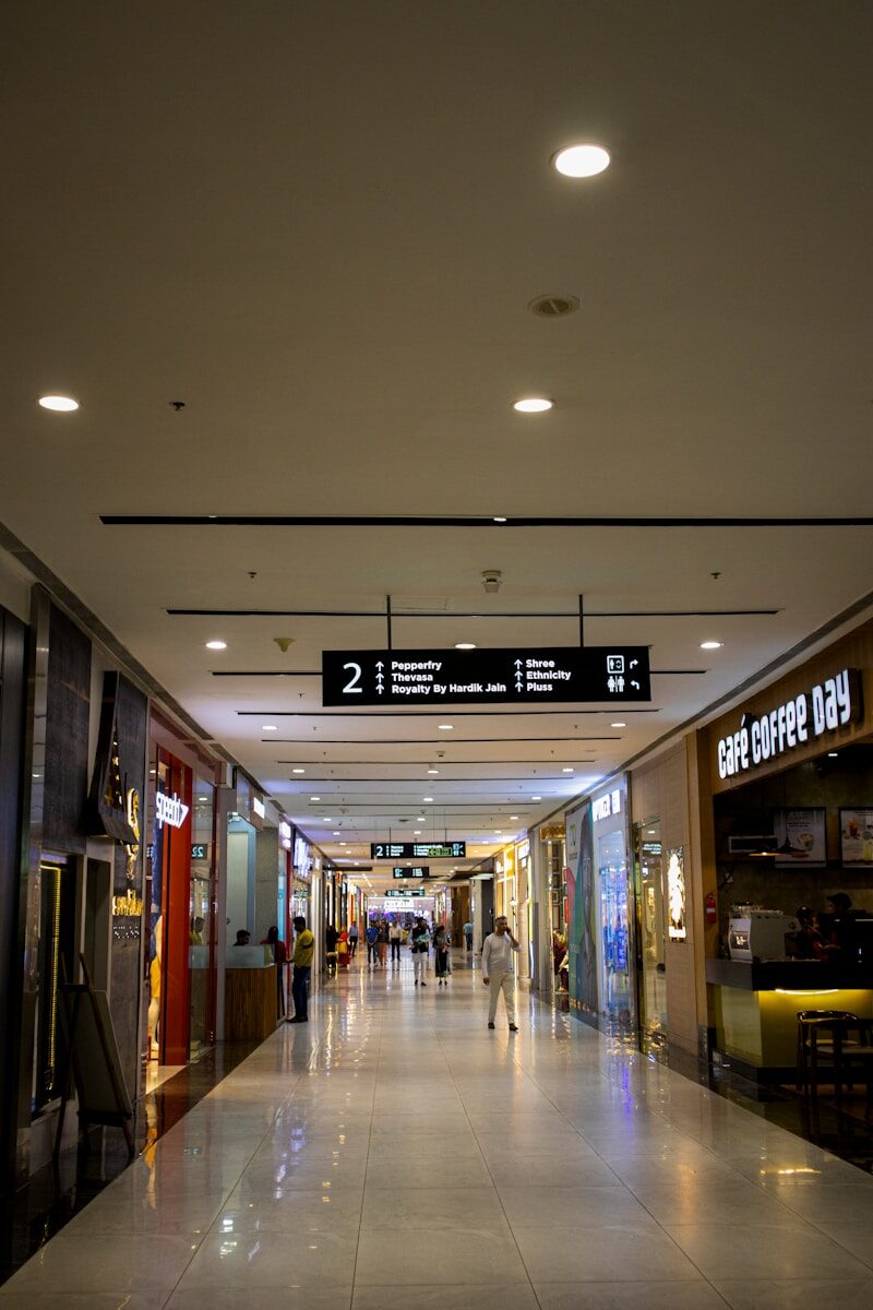 a couple of people that are walking down a hallway