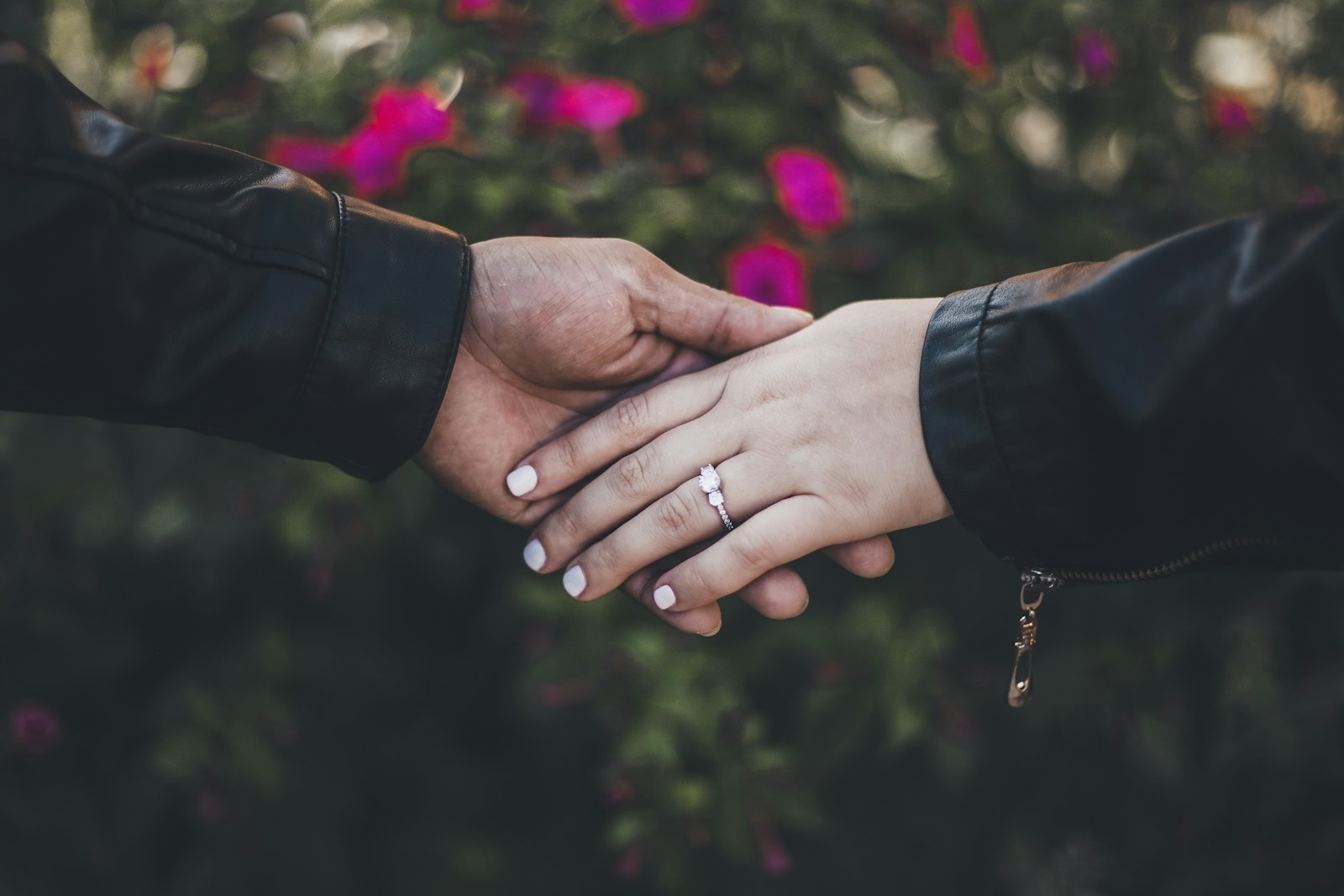 person in black long sleeve shirt with gold ring - transwomen in Marriages