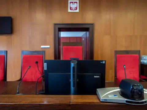 Artificial Intelligence, Judicial Integrity, and The - Modern courtroom interior in Wrocław, Poland featuring judge's bench a