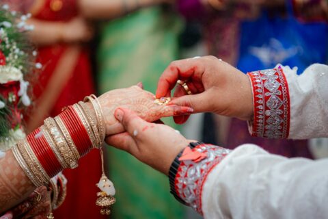 a couple getting married rings from each other