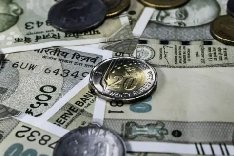 Delegation Without Abdication : The Regulatory - Detailed view of Indian rupee banknotes and coins, showcasing currency and f