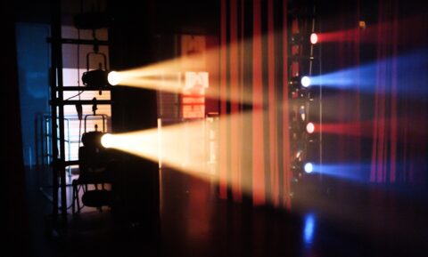 red and yellow light on a dark room - movie ticket overcharging