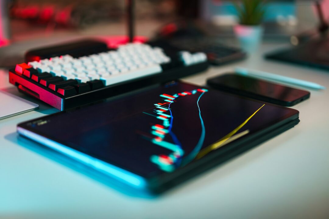A computer keyboard sitting on top of a desk
