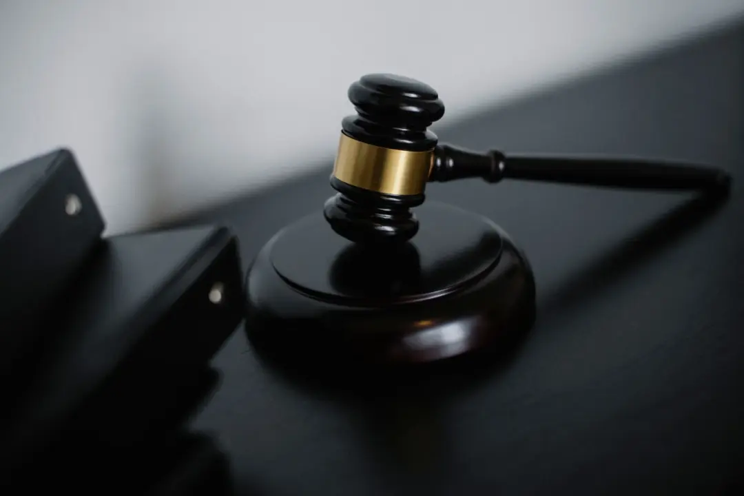 NCLAT Reaffirms: Concluded Auctions Cannot Be - High angle of shiny wooden ceremonial mallet with golden detail placed on jud
