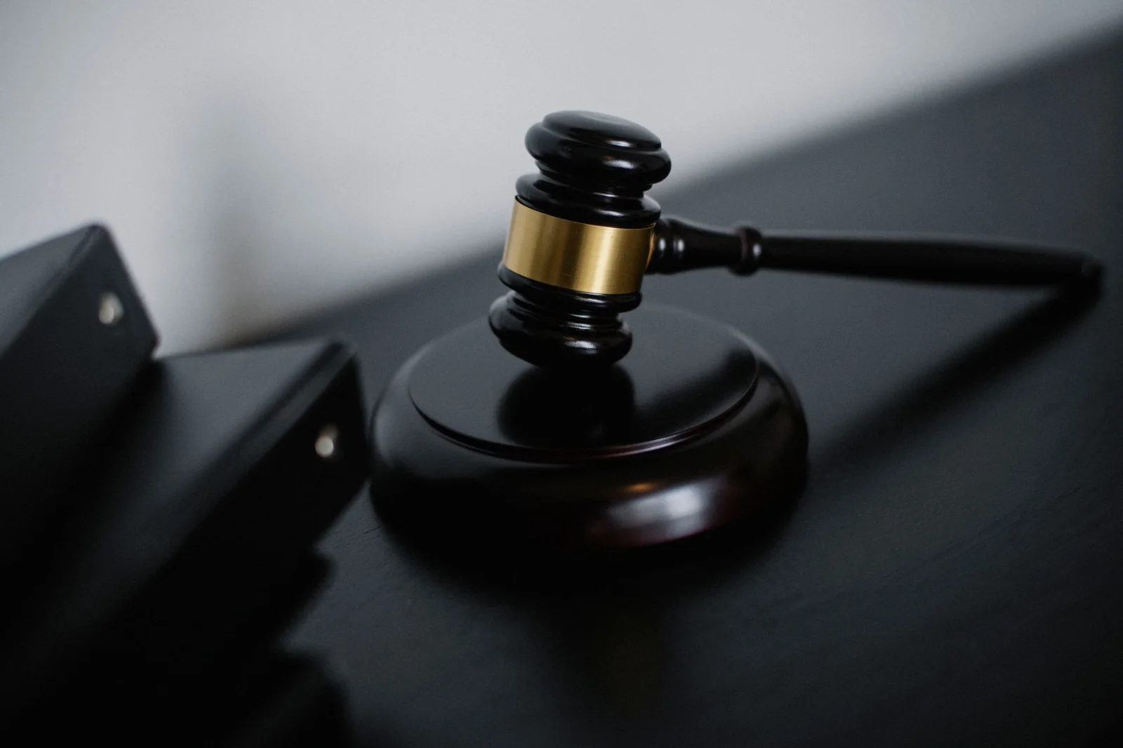 NCLAT Reaffirms: Concluded Auctions Cannot Be - High angle of shiny wooden ceremonial mallet with golden detail placed on jud