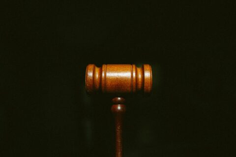 brown wooden stand with black background - Saravana Prasad v. Endemol India Pvt. Ltd.