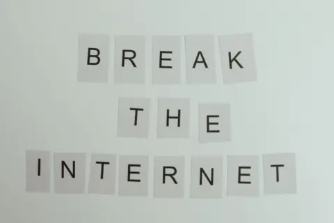 Patents And Panels: Decoding Arbitrability of - Conceptual image with text 'Break the Internet' using letter cards on a light