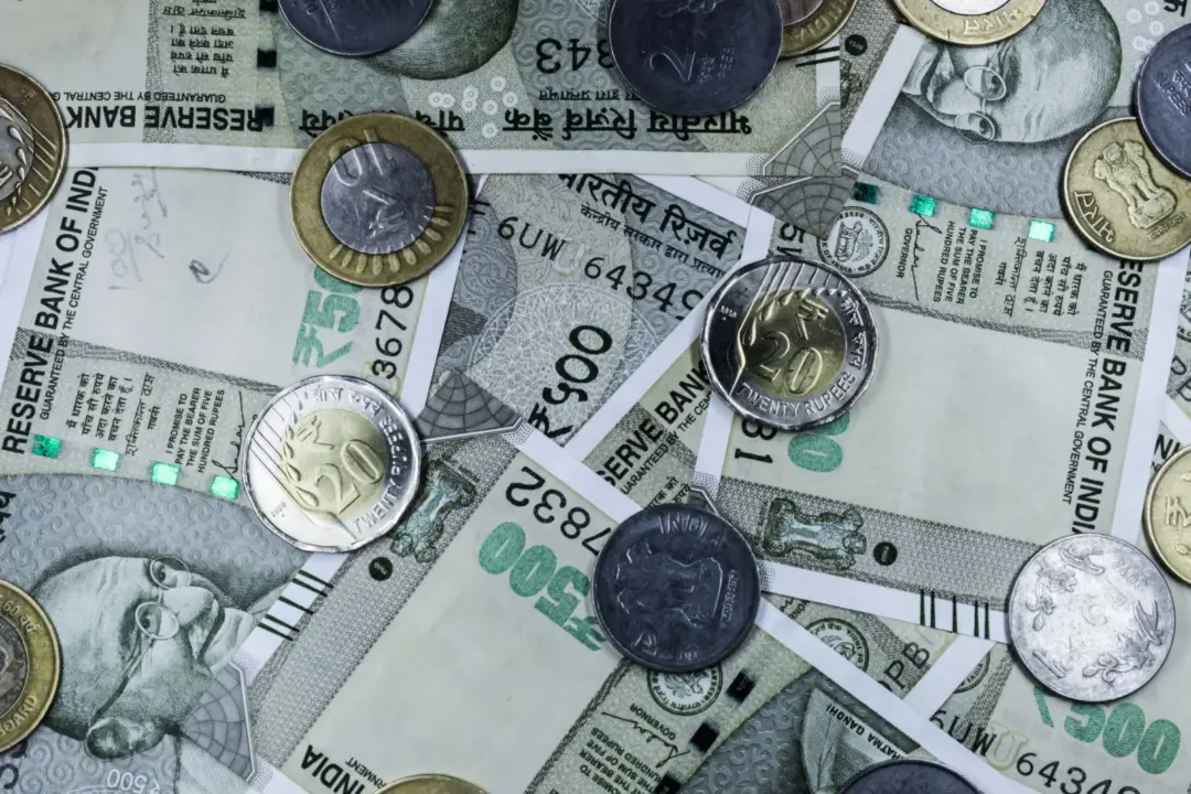 Rationalising Cross-Border Compliance: The Reserve Bank - Top view of various Indian rupee banknotes and coins, highlighting