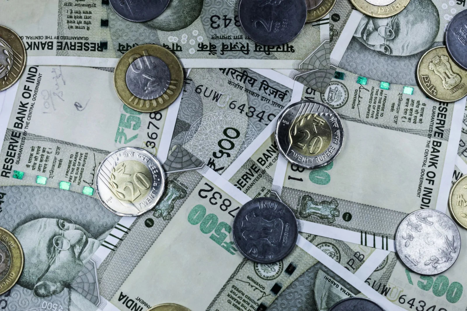 Rationalising Cross-Border Compliance: The Reserve Bank - Top view of various Indian rupee banknotes and coins, highlighting