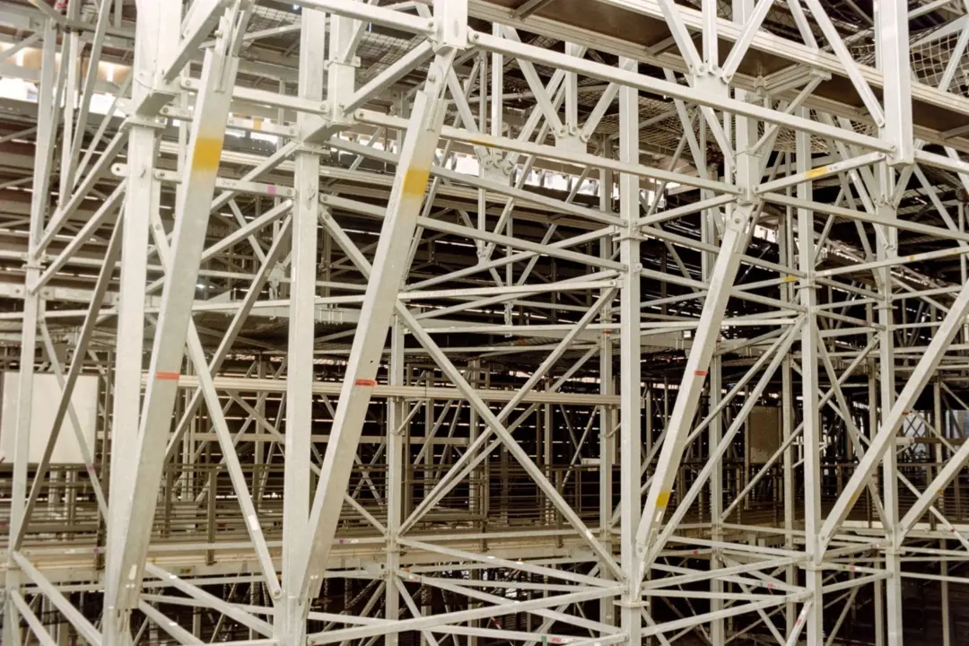 Refining the FEMA Framework: An Analysis - Intricate metal scaffolding structure indoors, showcasing robust industrial archit