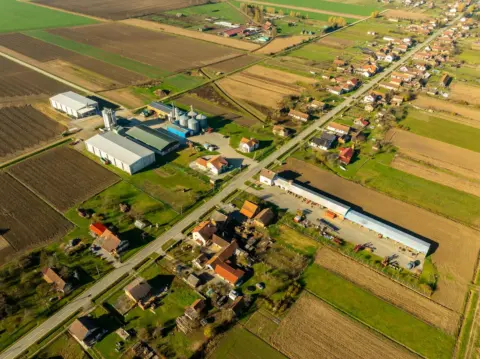 supreme court residential sale deed compensation - Aerial view of rural landscape in Garešnica, Croatia with farmlands and bu