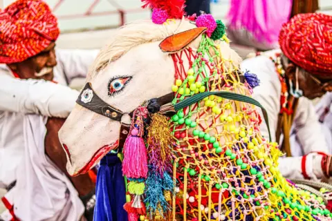 Vibrant close-up of Rajasthani traditional festival with colorful decorations and cultural attire.