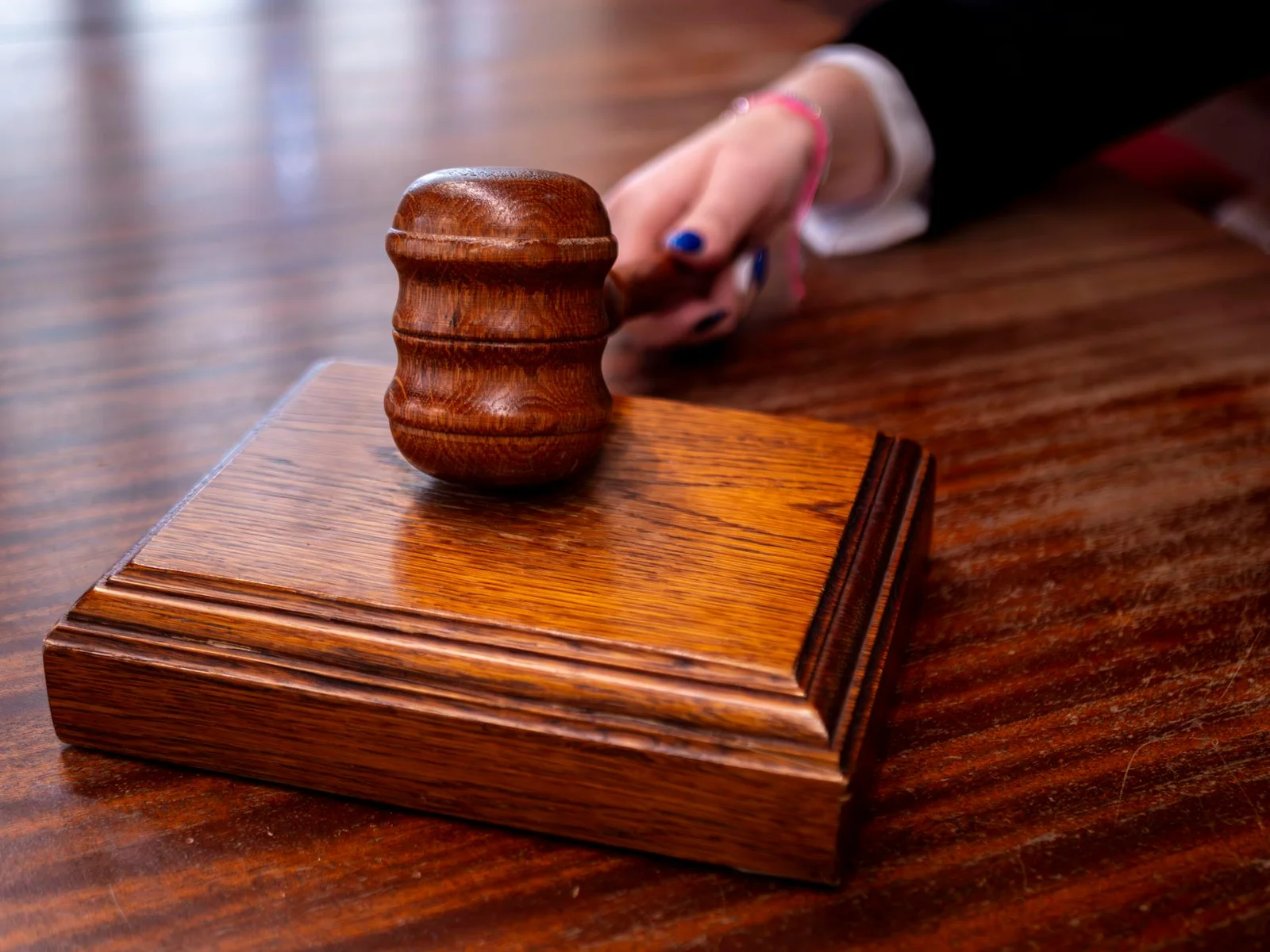 section 29a arbitration extension sufficient cause - Close-up of a wooden judge's gavel on a desk in a courtroom, symbolizing