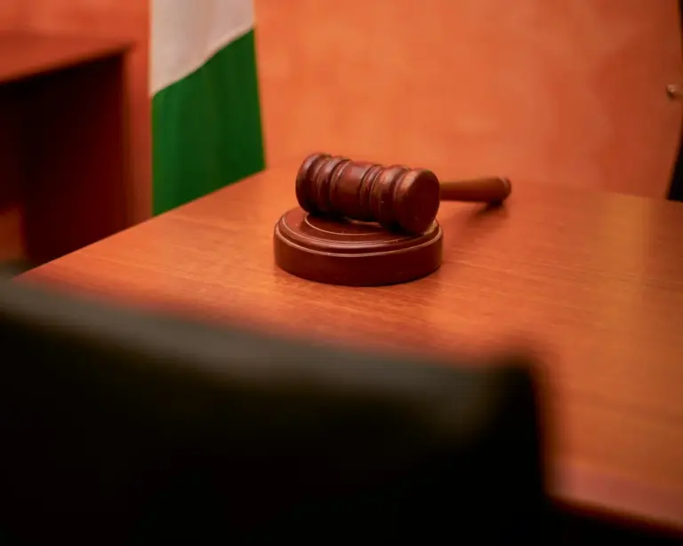 commercial court jurisdiction section 15 commercial - A close-up of a gavel on a courtroom desk representing law and justice.