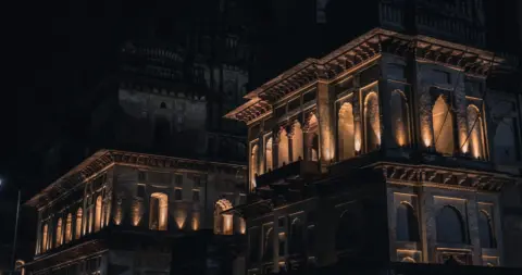 land acquisition compensation constitutional right madhya - Night view of a beautifully illuminated historic building, showca