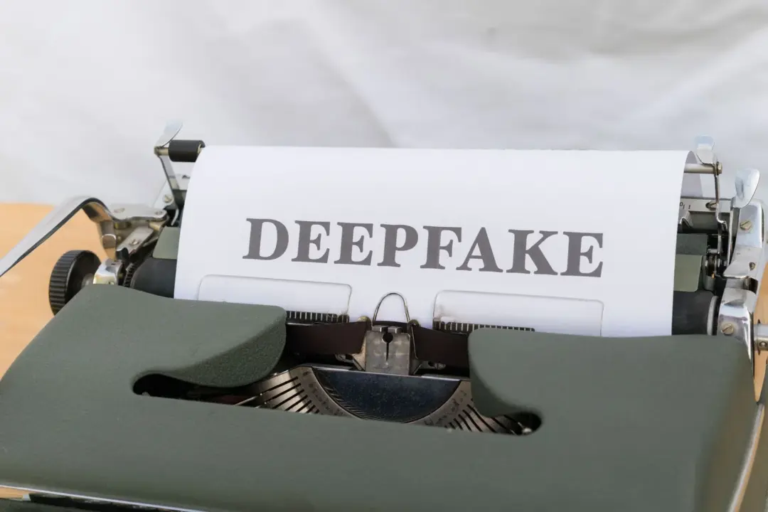 personality rights deepfakes digital protection india - Old-fashioned typewriter with a paper labeled 'DEEPFAKE', symbolizing