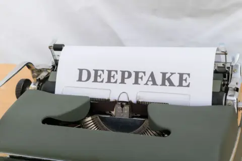 personality rights deepfakes digital protection india - Old-fashioned typewriter with a paper labeled 'DEEPFAKE', symbolizing