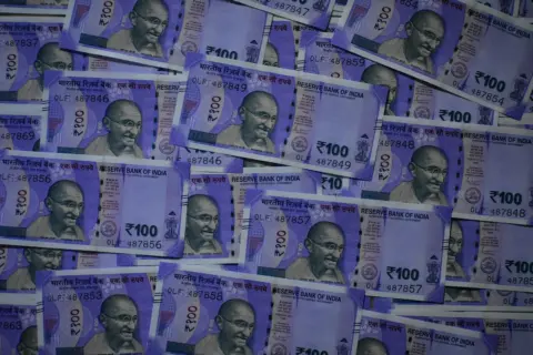 SARFAESI limitation guarantor enforcement - Procedural - Close-up image of Indian Rupee banknotes in Kolkata, India showcasin