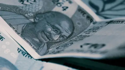 sarfaesi pre-deposit borrowers calcutta high court - Detailed close-up of Indian Rupee banknotes with iconic Gandhi portrait,