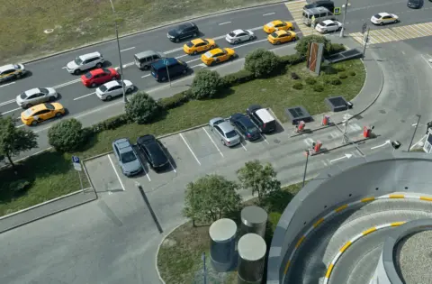 stationary vehicle parking highway liability - - Aerial shot of traffic and parking area in Moscow, showcasing urban life and