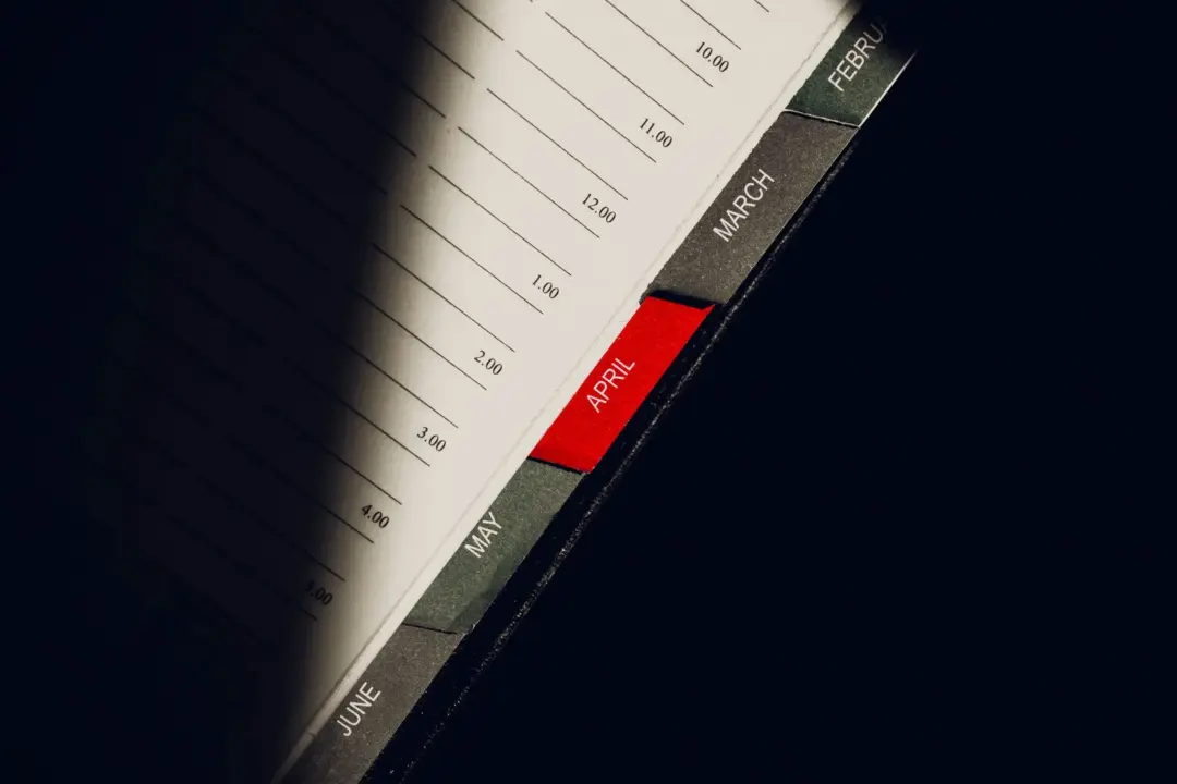 section 8 arbitration waiver - Section - A close-up shot of a planner highlighting the month of April with visible monthly ta