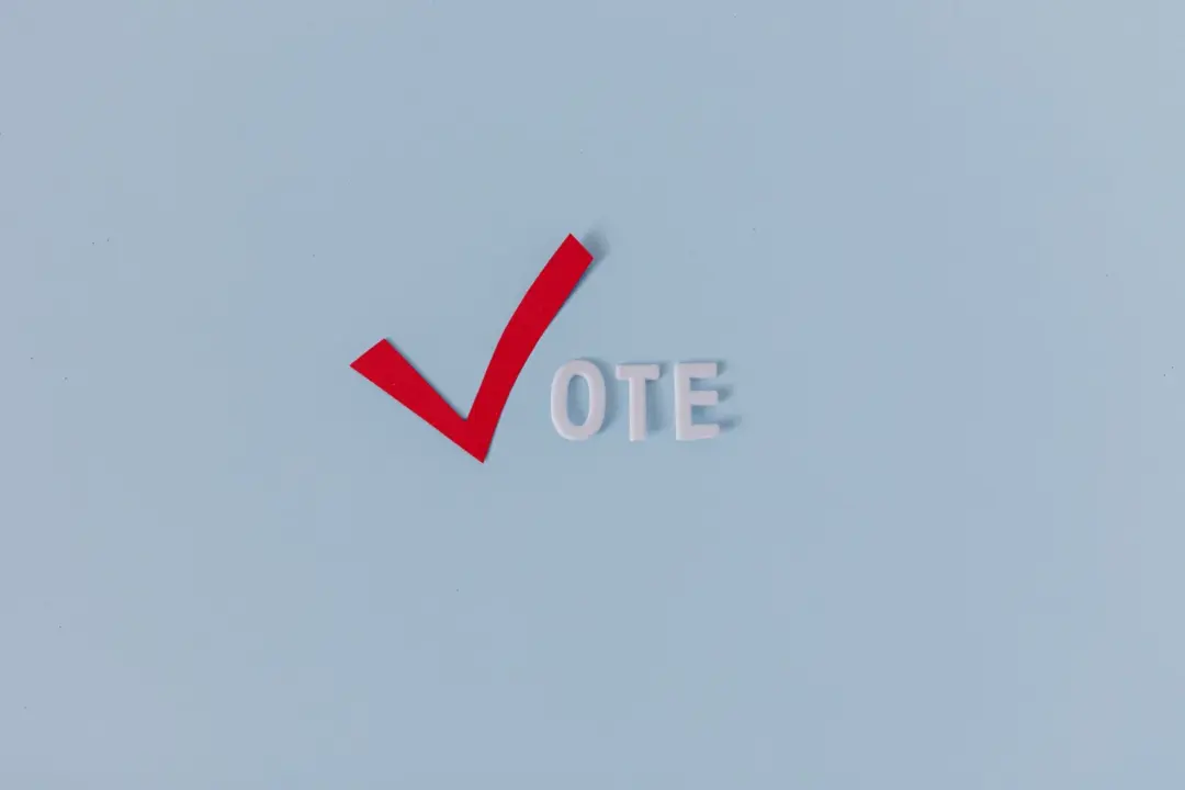 Supreme Court Rejects ‘Vote-Cast-First’ Rule: Only - Red check mark with the word "VOTE" on a blue background, symbolizing el