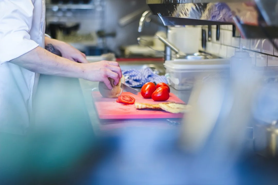 Suspension Is Not a Standing Penalty: - Person slicing tomatoes