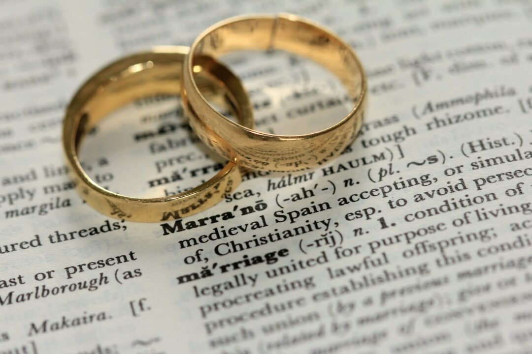 two gold-colored rings on paper - redevelopment right